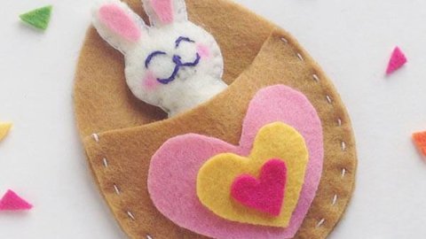 Felt Easter bunny in egg bed with layered heart blanket