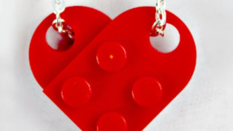 Red LEGO heart necklace on silver chain