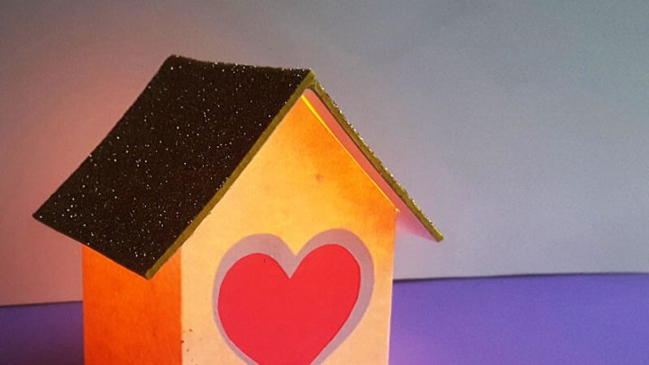 Valentine paper lantern house with glowing heart window