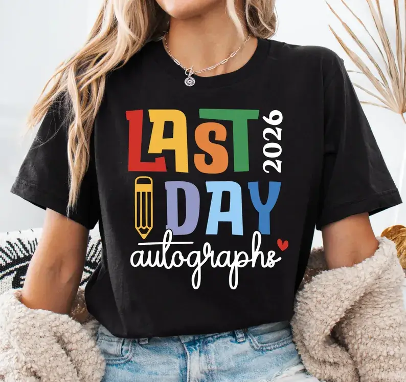 Elementary graduation gifts black t-shirt featuring colorful "Last Day 2026 Autographs" text with rainbow letters and pencil graphic, perfect for end-of-year celebrations. Etsy