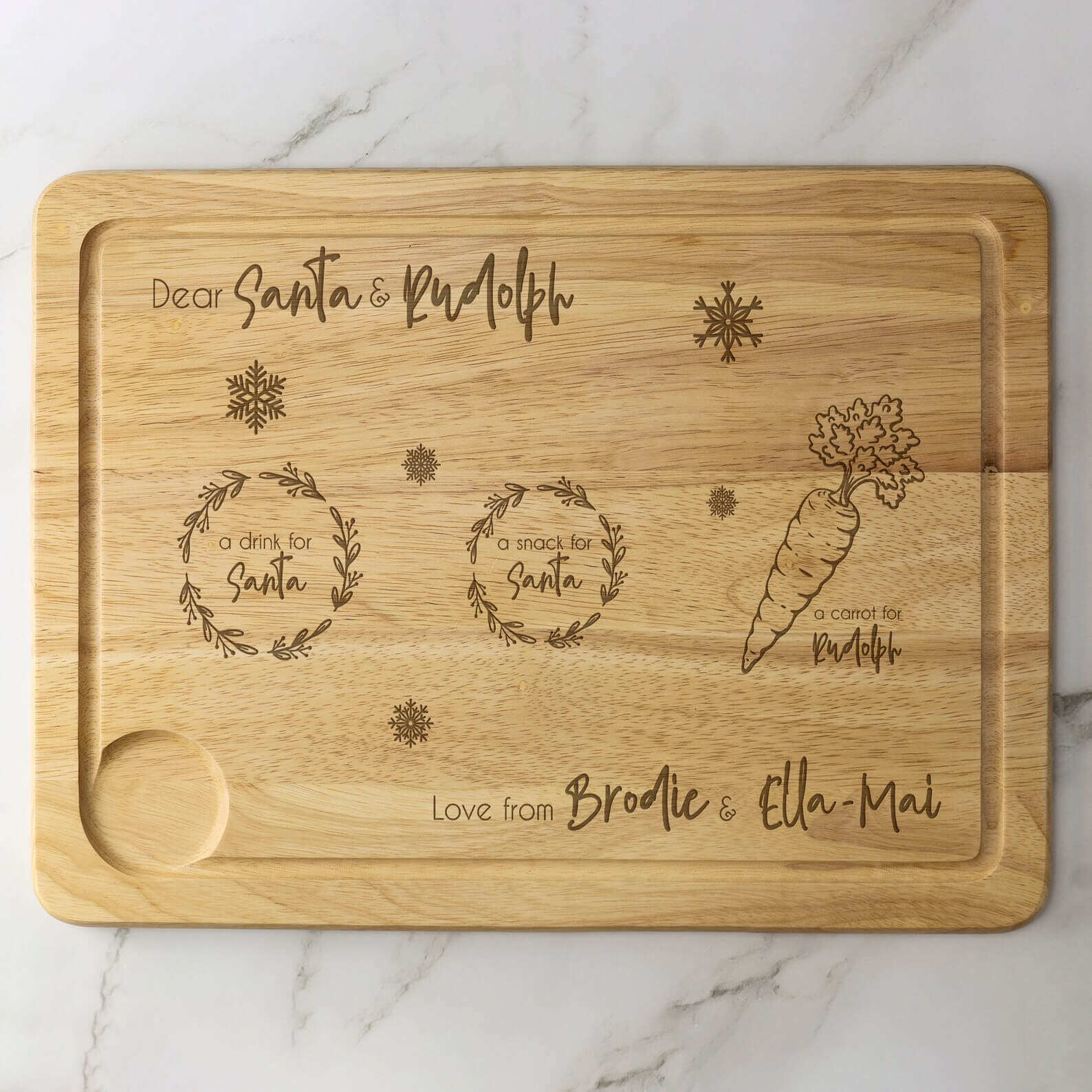 Engraved wooden board with designated spots for Santa's drink, snack, and Rudolph's carrot, personalized with children's names, a charming Christmas Eve Box idea for tweens.