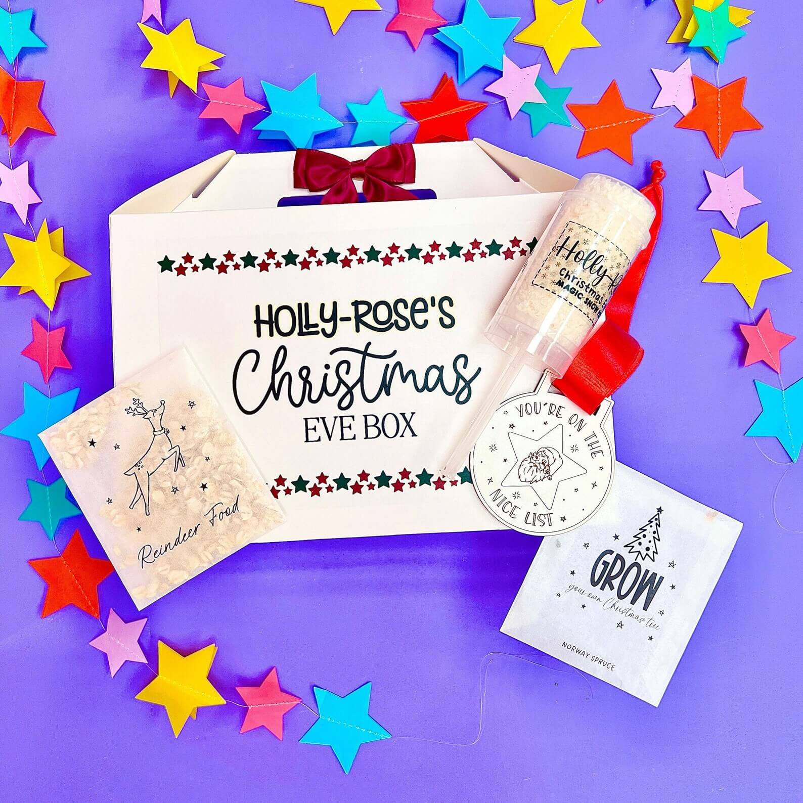 Personalized "Holly-Rose's Christmas Eve Box" with reindeer food, magic snow, "You're on the Nice List" tag, and grow-your-own tree seeds — festive Christmas Eve Box Ideas.