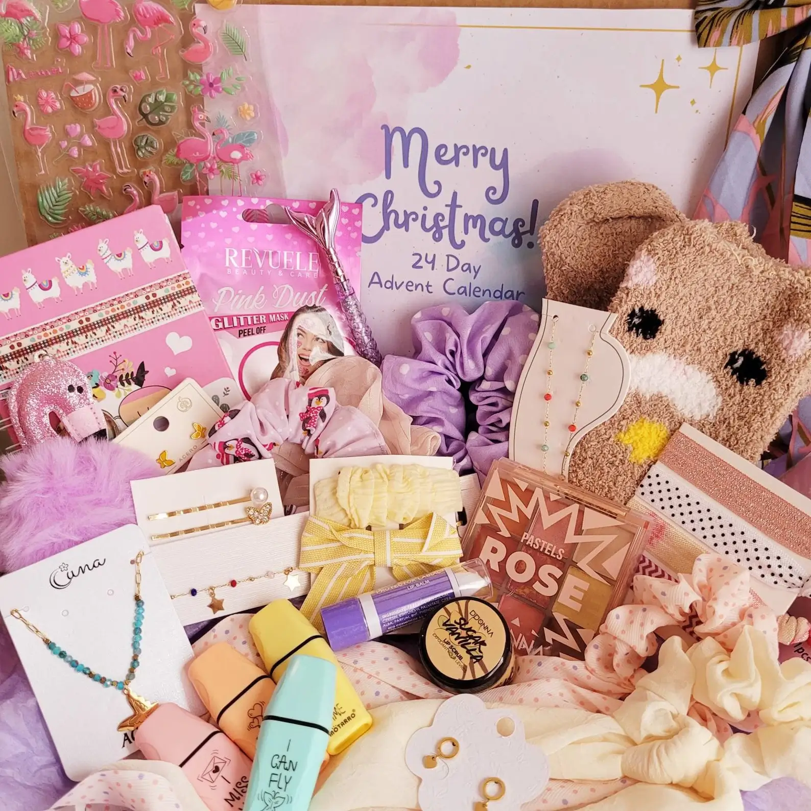 24-day tween advent calendar packed with scrunchies, jewelry, hair clips, glitter face mask, lip balm, flamingo stickers, and a fuzzy animal beanie in a pink Christmas theme.